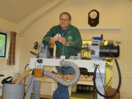 Paul explaining how he glues blanks for penguin turning